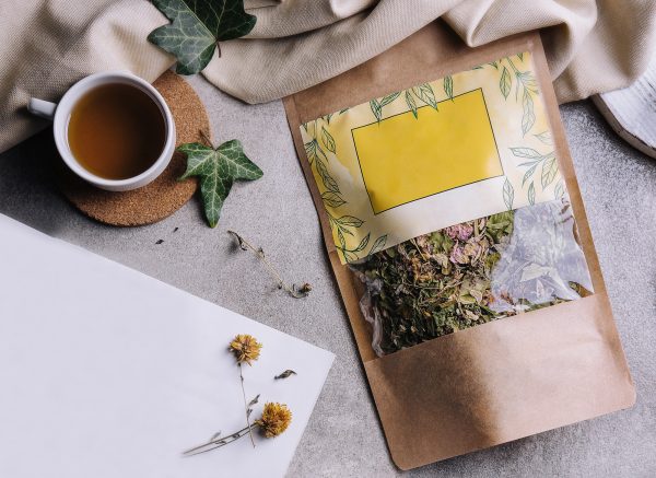 cup of tea with tangerines and tea packaging