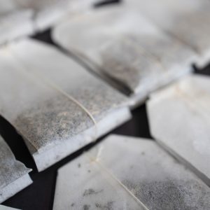 tea bags isolated on ocher background. Layout for your design.